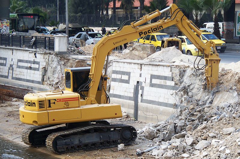wikiexcavatortearingdownwall.JPG